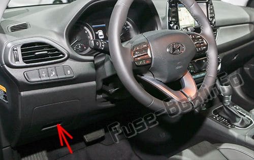 The location of the fuses in the passenger compartment: Hyundai Elantra GT (2018, 2019)
